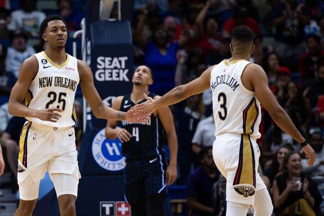 Feb 27, 2023; New Orleans, Louisiana, USA; New Orleans Pelicans guard Trey Murphy III (25) reacts to making a three point basket with guard CJ McCollum (3) against the Orlando Magic during the first half at Smoothie King Center.