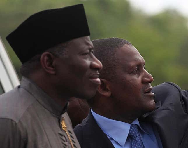 Nigeria’s former president Goodluck Jonathan (L) with Aliko Dangote in 2012