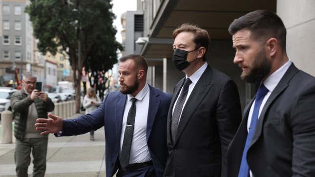 Tesla CEO Elon Musk (C) leaves the Phillip Burton Federal Building on February 03, 2023 in San Francisco, California. Closing arguments have wrapped up in the trial where investors are suing Tesla and Elon Musk, its chief executive officer, over his August 2018 tweets where he said he was taking Tesla private with funding that he secured. 