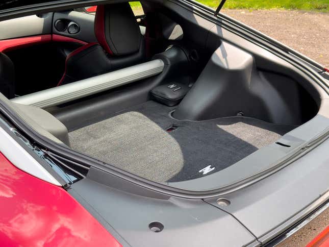 Cargo area with lift gate open image of red 2023 Nissan Z
