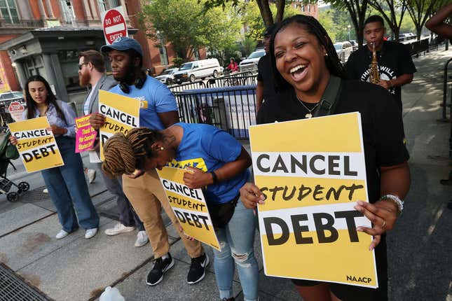  Student loan borrowers stage a rally in front of The White House to celebrate President Biden canceling student debt and to begin the fight to cancel any remaining debt on August 25, 2022, in Washington, DC.