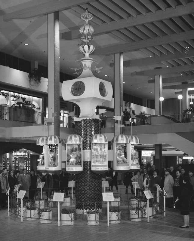 Photograph of a clock at the Midtown Plaza Shopping Center in Rochester, New York.