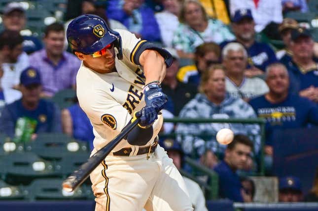Sep 14, 2023; Milwaukee, Wisconsin, USA; Milwaukee Brewers left fielder Tyrone Taylor (15) hits a double to drive in a run in the seventh inning against the Miami Marlins at American Family Field.