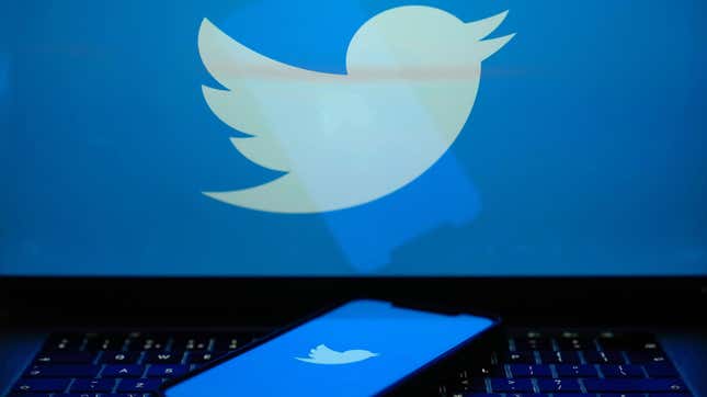 Stock photo of Twitter logo on laptop and phone