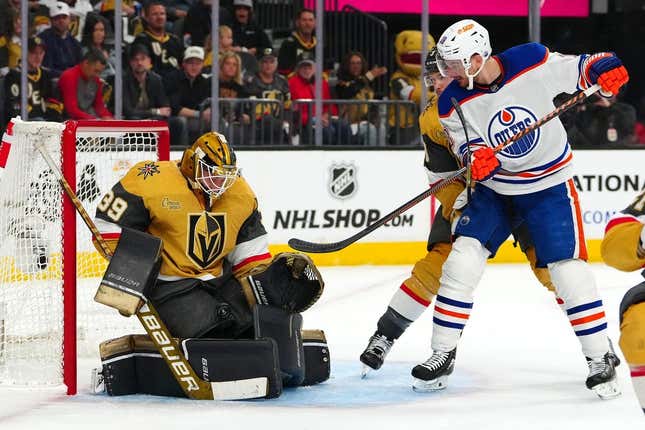 May 3, 2023; Las Vegas, Nevada, USA;Vegas Golden Knights goaltender Laurent Brossoit (39) makes a save against Edmonton Oilers left wing Zach Hyman (18) during the first period of game one of the second round of the 2023 Stanley Cup Playoffs at T-Mobile Arena.