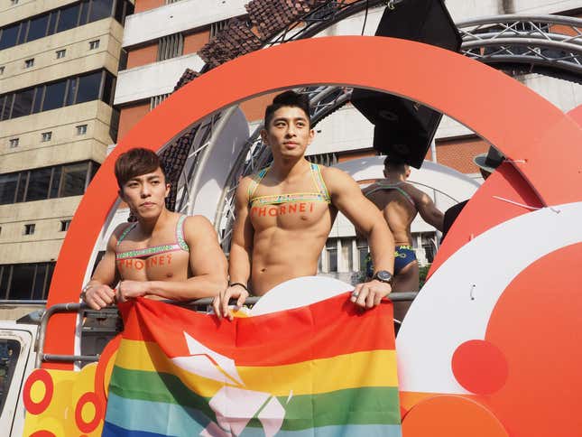 Men stand on a float at Taipei’s pride parade on Oct. 28, 2017.