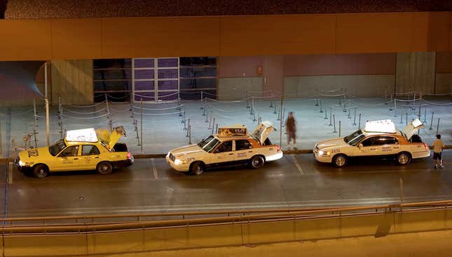 Taxi drivers at McCarran, most likely waiting to take the I-215 tunnel.