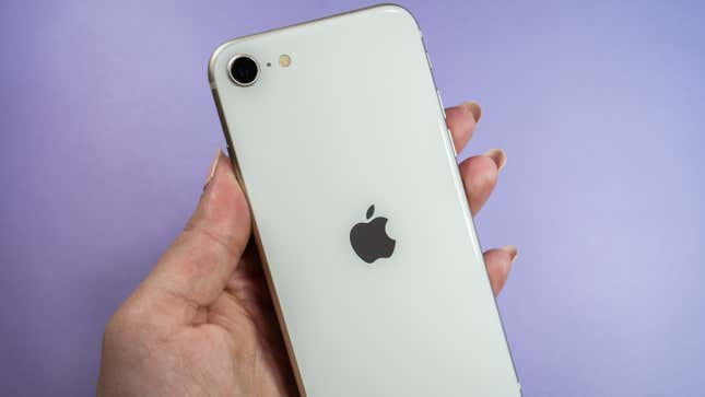 A photo of a person holding the iPhone SE