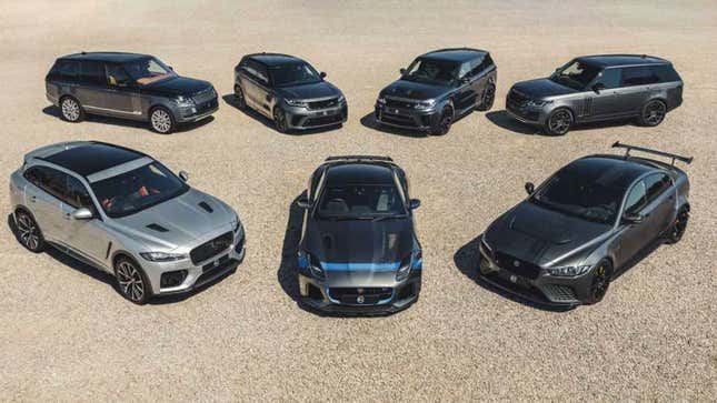 A photo of a lineup of Jaguar and Land Rover cars on sand. 