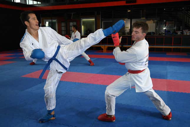 Afghan-born refugee and karate competitor Asif Sultani (L) training for the Olympics on the outskirts of Sydney.