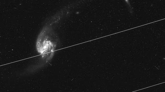 A Hubble image ruined by satellite streaks. 