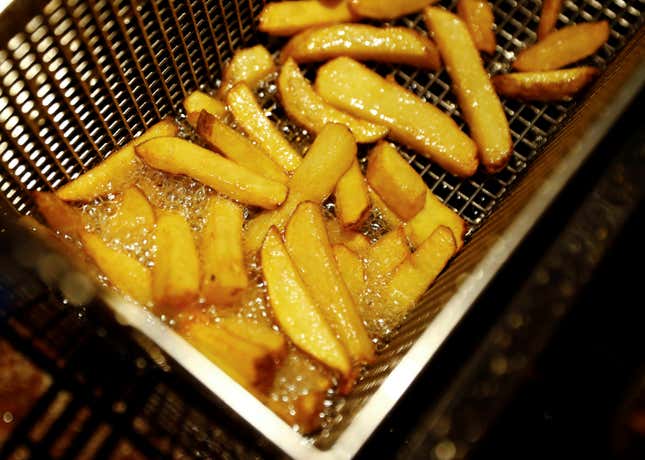 French fries are prepared at 'BurgerArt' restaurant in Berlin