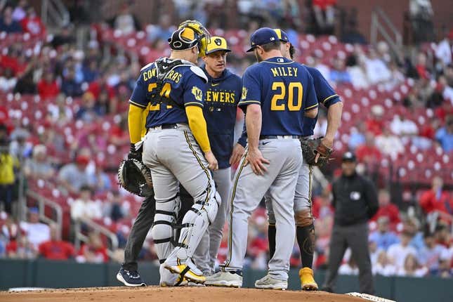 May 16, 2023; St. Louis, Missouri, USA;  Milwaukee Brewers manager Craig Counsell (30) talks with starting pitcher Wade Miley (20) during the second inning against the St. Louis Cardinals at Busch Stadium.