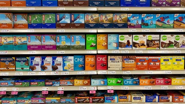 Shelf of protein energy nutritional bars at grocery store