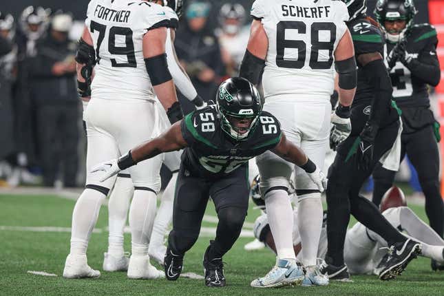 Dec 22, 2022; East Rutherford, New Jersey, USA; New York Jets defensive end Carl Lawson (58) celebrates a defensive stop during the first half against the Jacksonville Jaguars at MetLife Stadium.