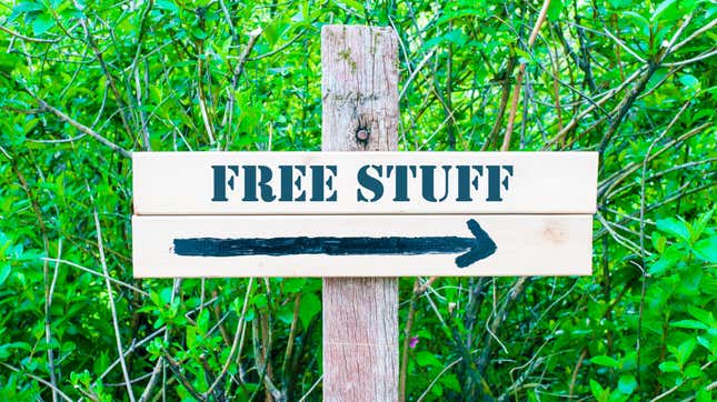 A wooden sign reading "free stuff" with an arrow pointing to the right