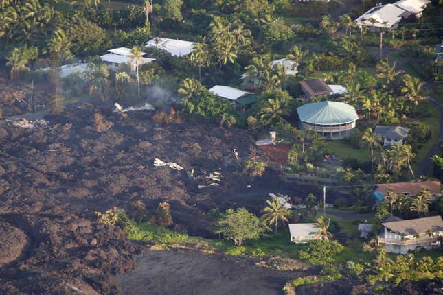 Image for article titled New aerial photos show Kilauea’s lava devouring neighborhoods