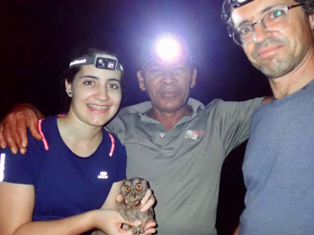 photo of three people and small owl