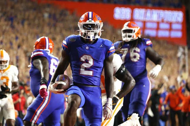 Sep 16, 2023; Gainesville, Florida, USA; Florida Gators running back Montrell Johnson Jr. (2) runs the ball in for a touchdown against the Tennessee Volunteers  during the second quarter at Ben Hill Griffin Stadium.