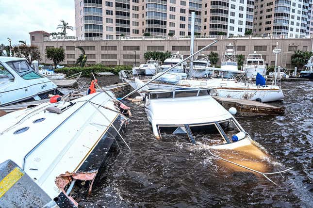 Boat are partially submerged at a marina in the aftermath of Hurricane Ian in Fort Myers, Florida, on September 29, 2022.
