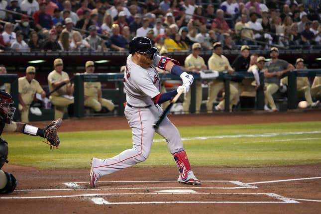 May 26, 2023; Phoenix, Arizona, USA; Boston Red Sox third baseman Justin Turner (2) hits a double against the Arizona Diamondbacks during the first inning at Chase Field.