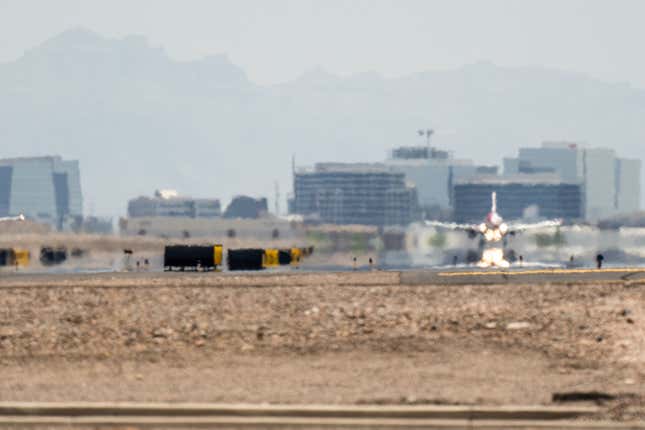  An airplane lands at the Phoenix Sky Harbor International Airport during a heat wave on July 15, 2023 in Phoenix, Arizona. Weather forecasts today are expecting temperatures to reach 115 degrees. The Phoenix area is grappling with record-breaking temperatures as prolonged heat waves continue soaring across the Southwest. 