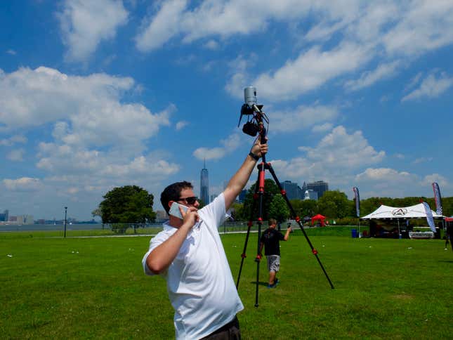 A 5D Robotics employee holding up a Velodyne Lidar sensor.