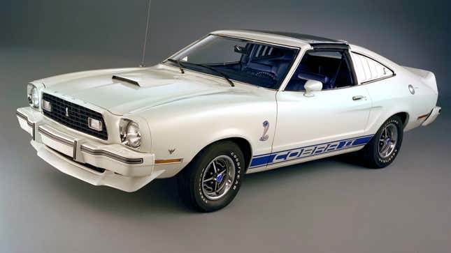 A white Ford Mustang MKII muscle car. 