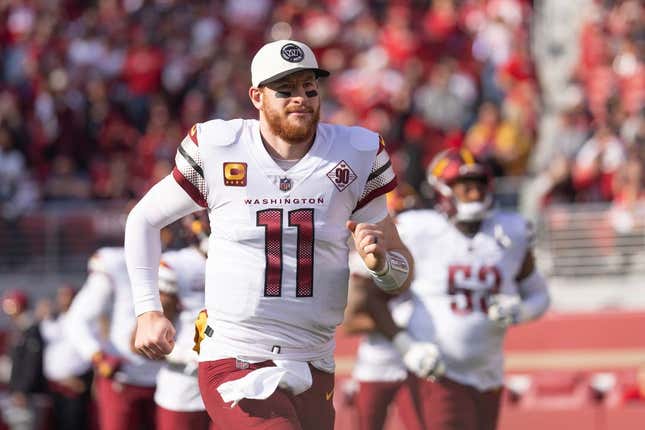 Dec 24, 2022; Santa Clara, California, USA; Washington Commanders quarterback Carson Wentz (11) runs onto the field before the start of the first quarter against the San Francisco 49ers at Levi's Stadium.