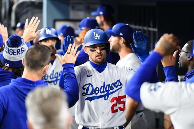 Apr 1, 2023; Los Angeles, California, USA; Los Angeles Dodgers center fielder Trayce Thompson (25) celebrates with teammates in the dugout after hitting a home run against the Arizona Diamondbacks during the fifth inning at Dodger Stadium.