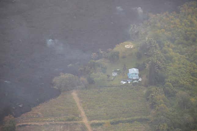 Image for article titled New aerial photos show Kilauea’s lava devouring neighborhoods