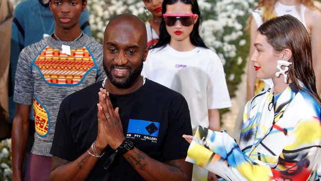 Designer Virgil Abloh appears with model Gigi Hadid at the end of his Spring/Summer 2020 collection show for his label Off-White in Paris