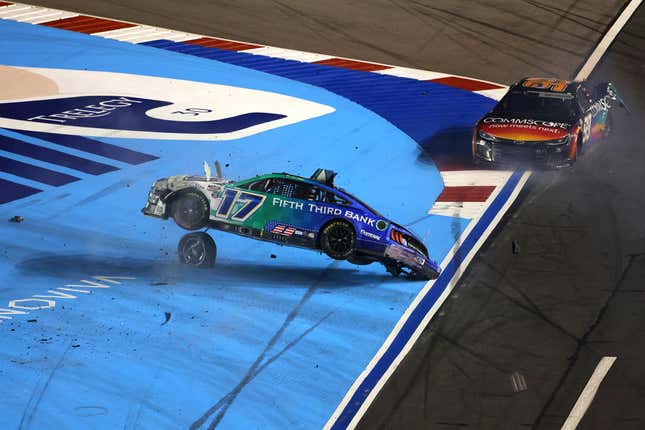 Chris Buescher, driver of the No. 17 Fifth Third Bank Ford, flips after an on-track incident with Daniel Suarez, driver of the No. 99 CommScope Chevrolet, during the NASCAR Cup Series Coca-Cola 600 at Charlotte Motor Speedway on May 29, 2022 in Concord, North Carolina. 