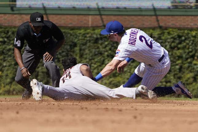 Sep 9, 2023; Chicago, Illinois, USA; Arizona Diamondbacks catcher Gabriel Moreno (14) steals second base as Chicago Cubs second baseman Nico Hoerner (2) makes a late tag during the third inning at Wrigley Field.