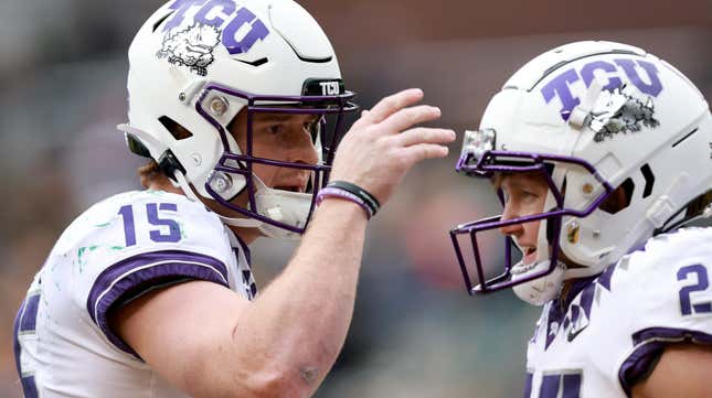 Wide receiver Gunnar Henderson celebrates with quarterback Max Duggan #15 of the TCU Horned Frogs after scoring a touchdown against the Baylor Bears in the third quarter.
