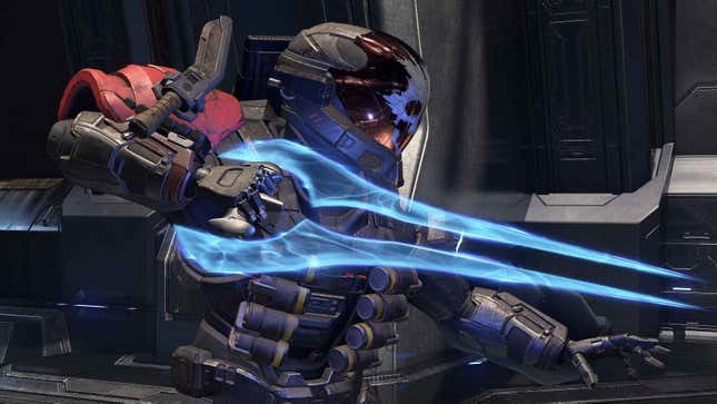 A Spartan wearing a skull helmet wields an energy sword in Halo Infinite.