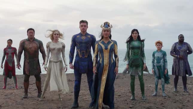 Marvel's Eternals heroes lined up on a beach in their fancy costumes.