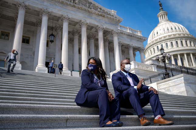 WASHINGTON, DC - MARCH 11: (L-R) Rep. Cori Bush (D-MO) and Rep. Jamaal Bowman (D-NY) talk with each other on the House steps before a news conference to discuss proposed legislation entitled Rent and Mortgage Cancellation Act outside the U.S. Capitol on March 11, 2021 in Washington, DC. 
