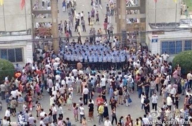 Parents and local residents around No. 3 high school in Zhongxiang, Hubei province.