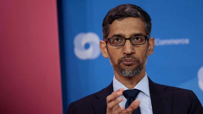 Sundar Pichai staring at the screen gesturing with his hand.