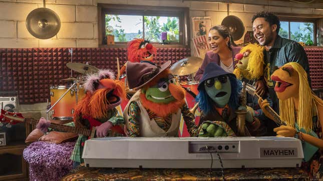 (L-R) Lily Singh, Taj Mowry, and The Electric Mayhem in The Muppets Mayhem