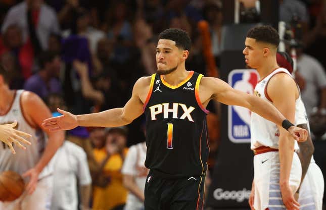 May 5, 2023; Phoenix, Arizona, USA; Phoenix Suns guard Devin Booker (1) celebrates with teammates against the Denver Nuggets in the second half during game three of the 2023 NBA playoffs at Footprint Center.