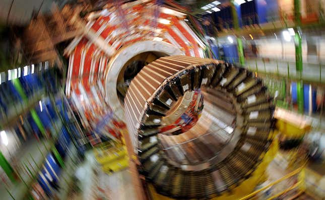 A blurry image shows the cylindrical magnet used in the central part of the Large Hadron Collider.