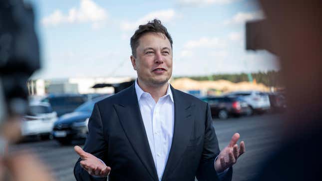 A photo of Elon Musk at a Tesla 'Gigafactory'