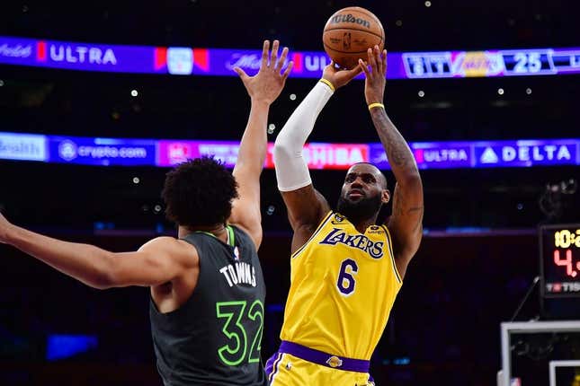 Apr 11, 2023; Los Angeles, California, USA; Los Angeles Lakers forward LeBron James (6) shoots against Minnesota Timberwolves center Karl-Anthony Towns (32) during the first half at Crypto.com Arena.