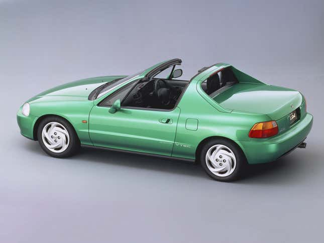 A rear three-quarter view of a green Honda CR-X del Sol.