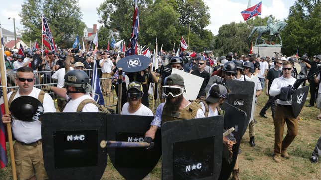 White nationalist demonstrators hold their ground as they clash with counter demonstrators in Lee Park.