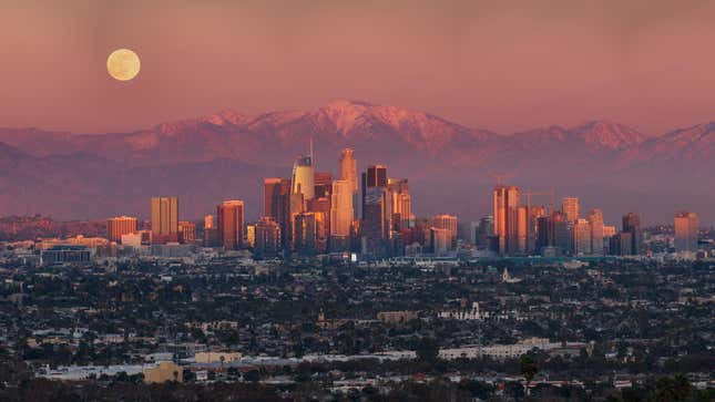 Los Angeles, with the mountains and Moon behind it. 