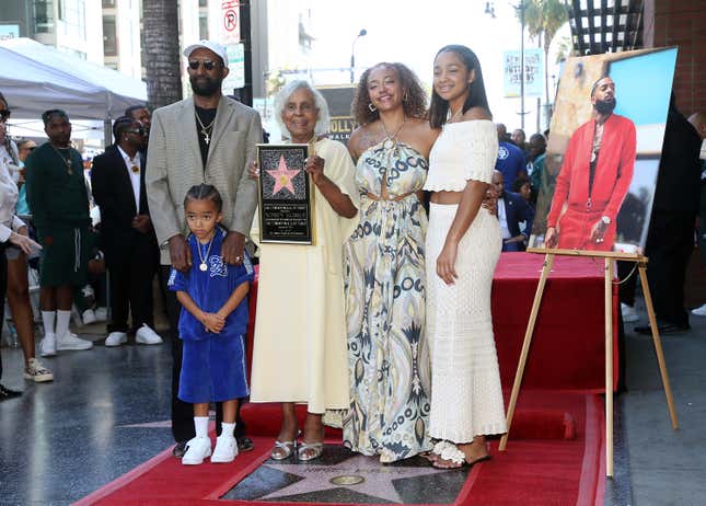 (L-R) Dawit Asghedom, Kross Ermias Asghedom, Margaret Boutte, Samantha Smith, and Emani Asghedom are seen as Nipsey Hussle is posthumously honored with a star on The Hollywood Walk of Fame on August 15, 2022 in Los Angeles, California.