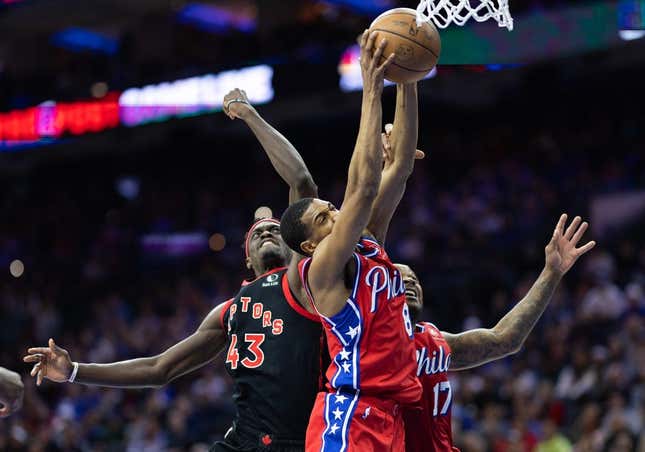 Mar 31, 2023; Philadelphia, Pennsylvania, USA; Philadelphia 76ers guard De'Anthony Melton (8) rebounds the ball past Toronto Raptors forward Pascal Siakam (43) during the second quarter at Wells Fargo Center.